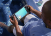 Steam Deck OLED vs ROG Ally X vs Switch 2: The 2026 Handheld Buyer’s Guide Steam Deck OLED handheld with Dave the Diver on screen