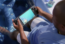 Steam Deck OLED vs ROG Ally X vs Switch 2: The 2026 Handheld Buyer’s Guide Steam Deck OLED handheld with Dave the Diver on screen