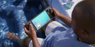 Steam Deck OLED vs ROG Ally X vs Switch 2: The 2026 Handheld Buyer’s Guide Steam Deck OLED handheld with Dave the Diver on screen